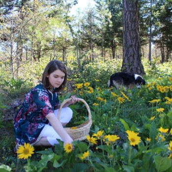 youth picks wildflowers at Great River for green burial