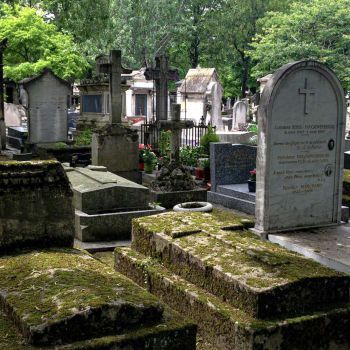 conventional cemetery filled with concrete graves and headstones