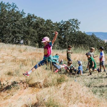 children playing in grand meadow