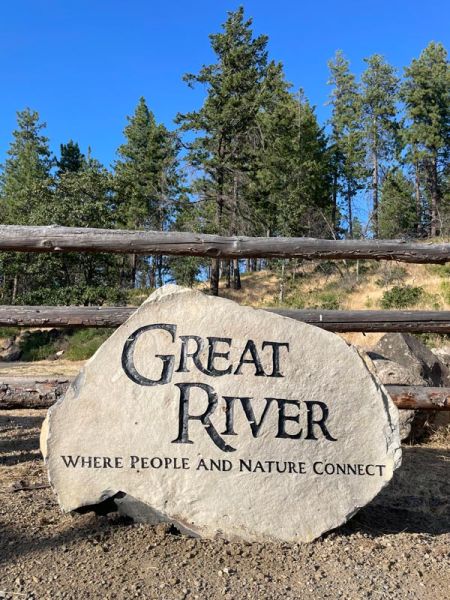 engraved stone entrance sign for Great River Oregon - Where People and Nature Connect